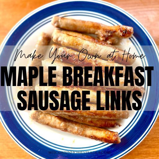 A plate of maple breakfast sausage links sits on a table.